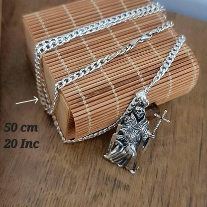 La Santa Muerte 925 Sterling Silver pendant holding a Cross and a Gun - 5CM ( 2 INCHES )